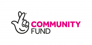 Image shows The National Lottery Community Fund logo. It is a white hand, with crossed fingers and eyes on the other fingers. The word community is in pink and fund in black.